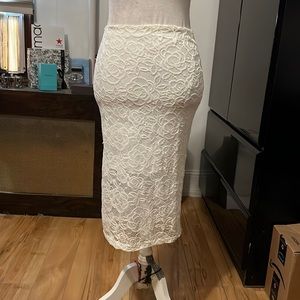 White floral lace w/ a shorter white skirt underneath pencil skirt